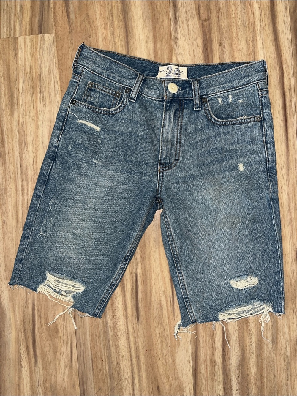 We the free distressed mid wash bermuda shorts